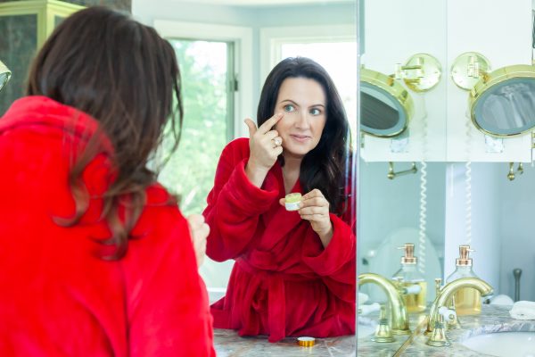 Aimee Raupp Putting ARB Eye Cream On