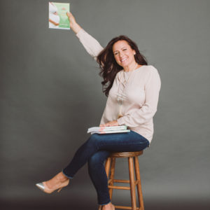 Image of Aimee Raupp Holding Her Book Yes You Can Get Pregnant