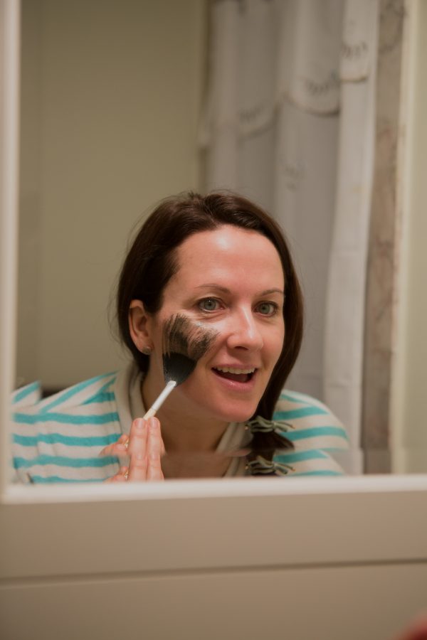 Image of Aimee Raupp Putting Green Goddess Mask on Face