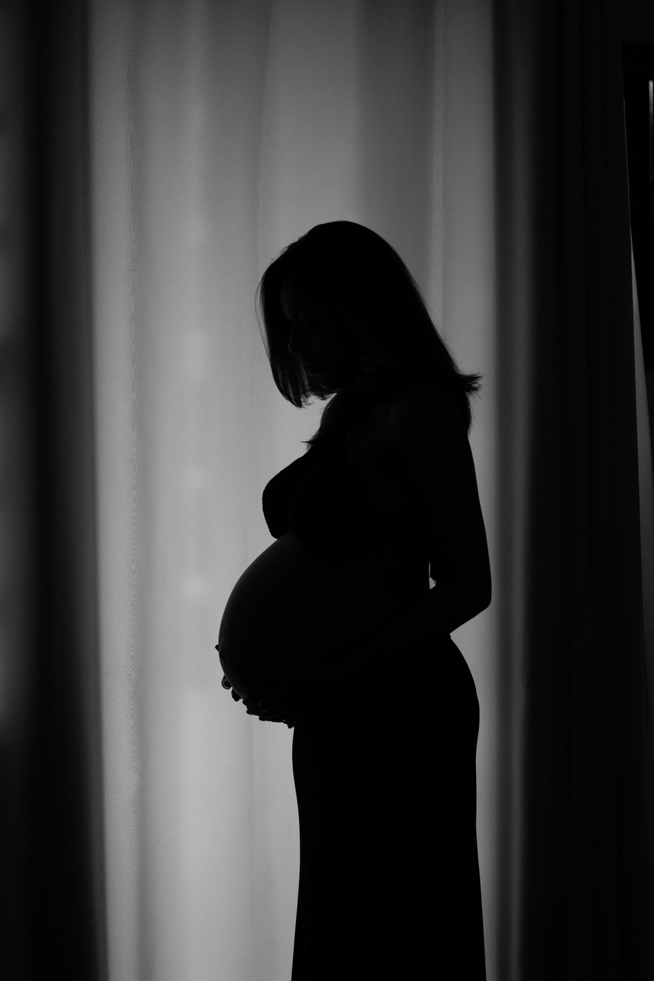 Image of Pregnant Woman Holding Belly