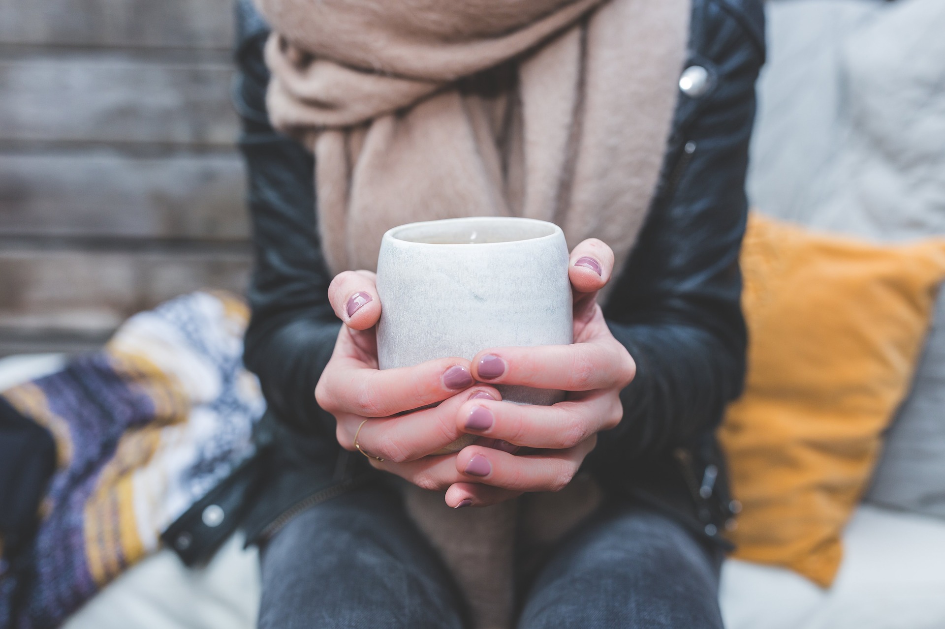 Image of Woman Holding a Coffee Cup