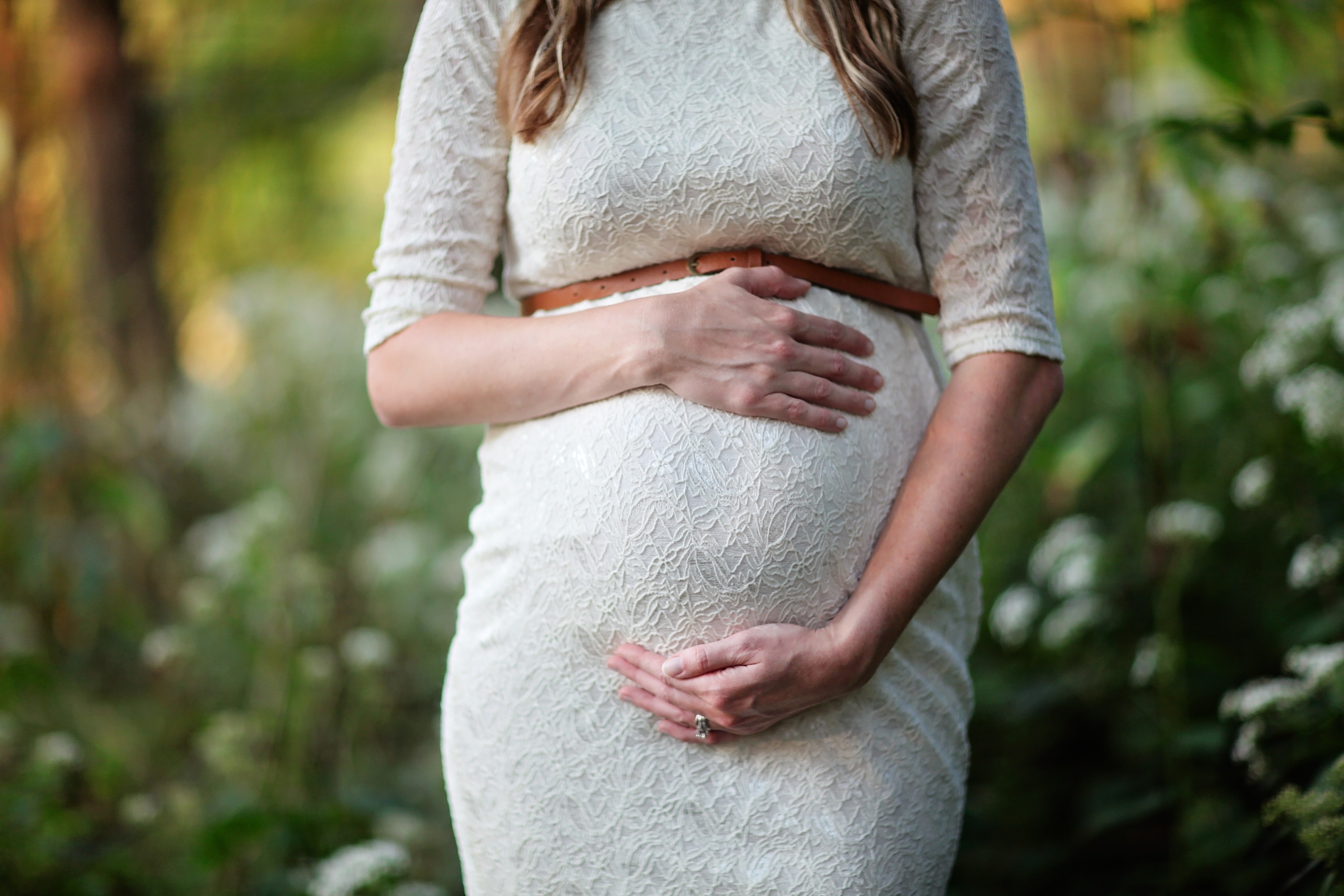 Image of Pregnant Woman Holding Belly