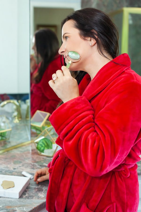 Image of Aimee Raupp Using Jade Roller