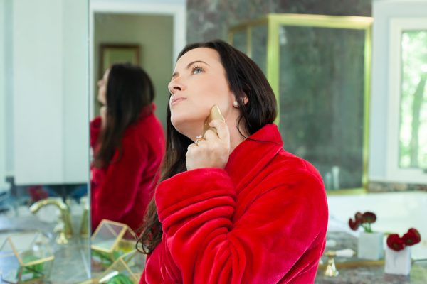 Image of Aimee Raupp Using Jade Roller