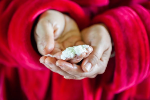 Image of Hands Holding Body Butter